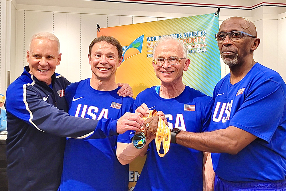Dr. Robert Bowen and his 3 other male teammates after winning a medal for Elite Senior Track