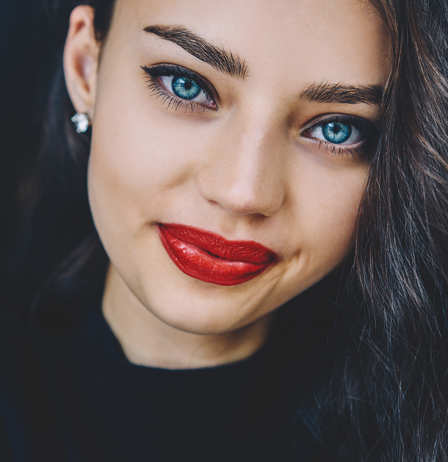 beautiful woman with dark wavy hair and red lips